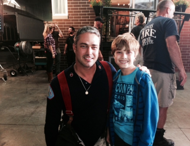 Cole Keriazakos with Taylor Kinney on set of Chicago Fire